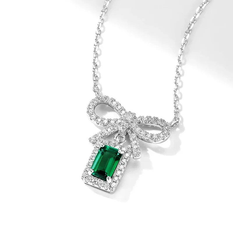 Emerald Bow Pendant Necklace angled pendant detail