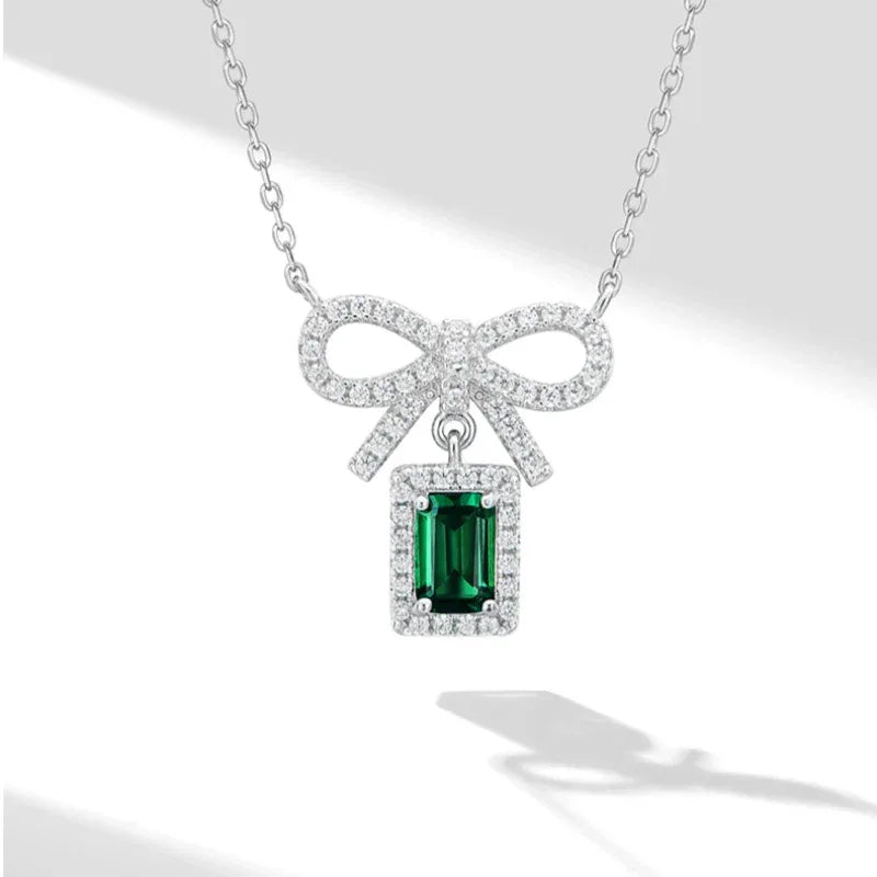 Emerald Bow Pendant Necklace pendant and chain detail on white