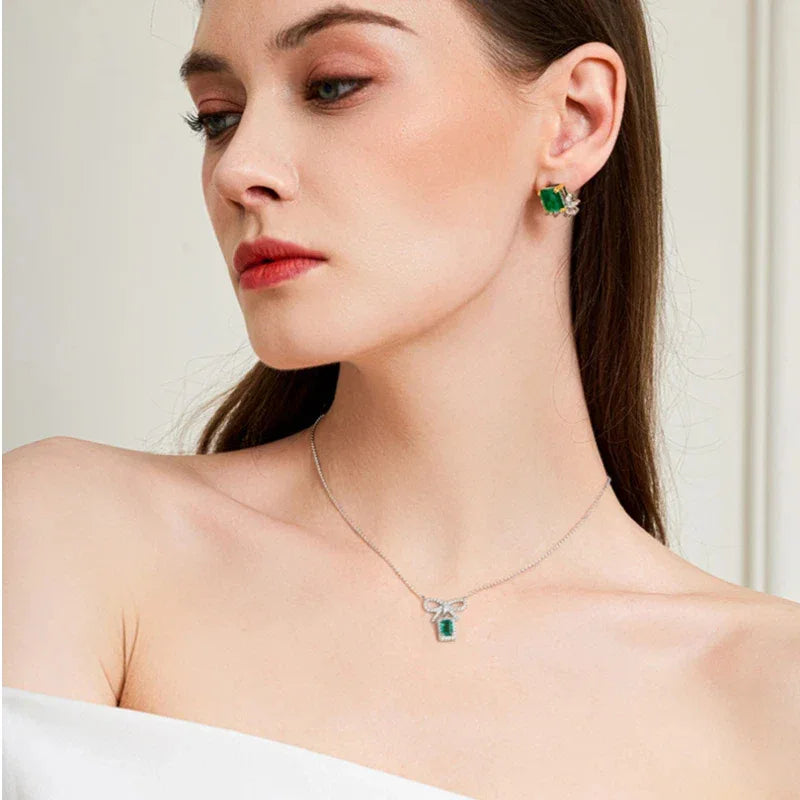 Emerald Bow Pendant Necklace worn at the neckline from a second angle