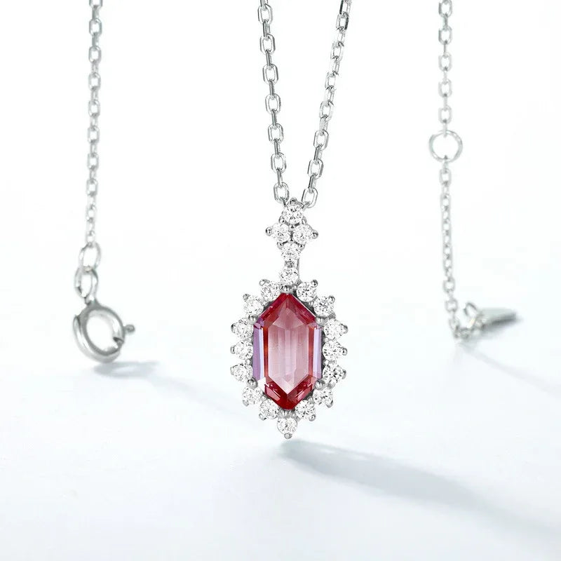 Emerald-cut Alexandrite halo pendant necklace, pink-toned Alexandrite view under alternate lighting
