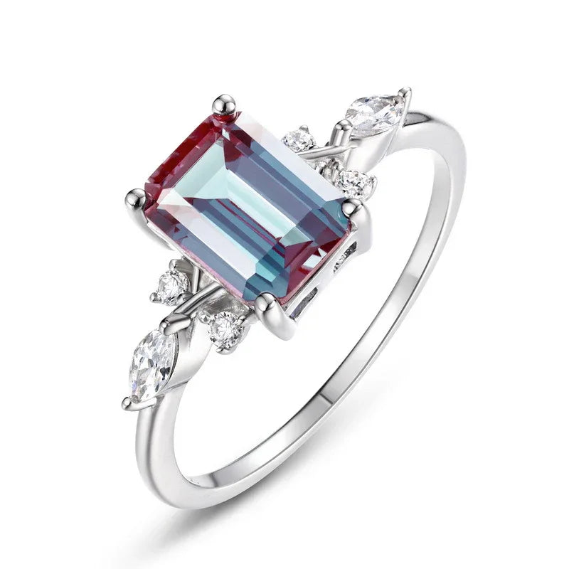 Emerald-cut Alexandrite ring with leaf side accents, alternate front product view on a white background