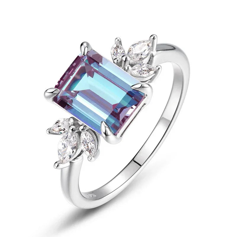 Emerald-cut Alexandrite open ring with leaf side accents, alternate front product view on a white background