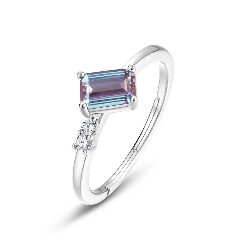 Emerald-cut Alexandrite open band ring with round clear accents, alternate front product view on a white background