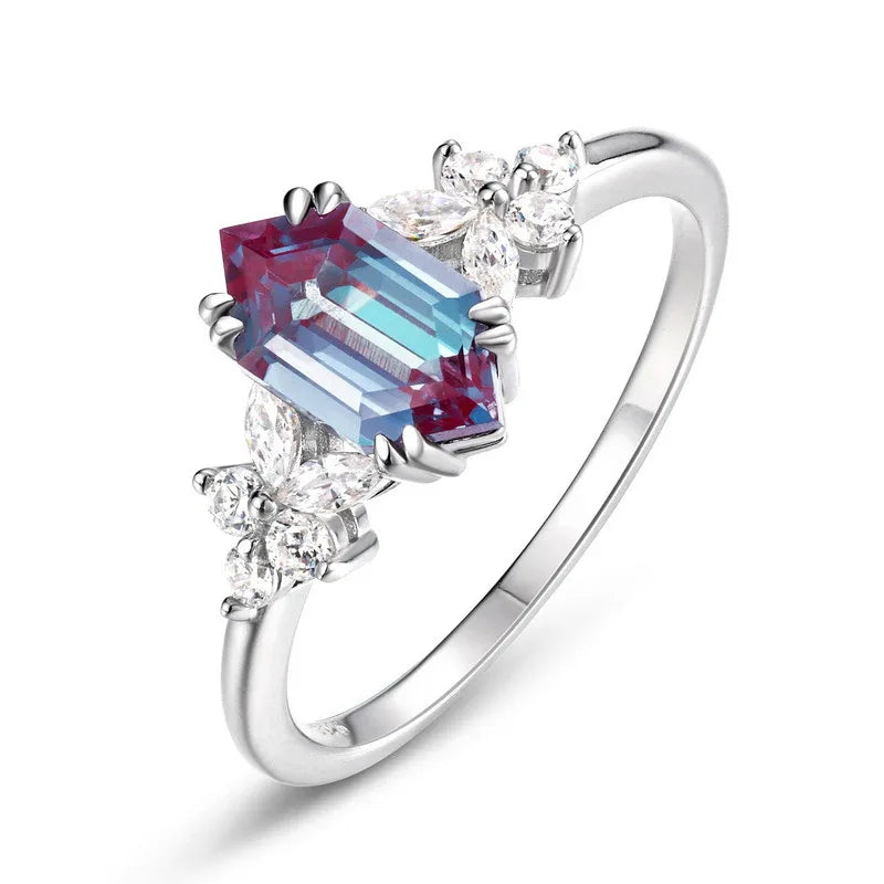 Emerald-cut Alexandrite ring with clear-stone side clusters, alternate front product view on a white background