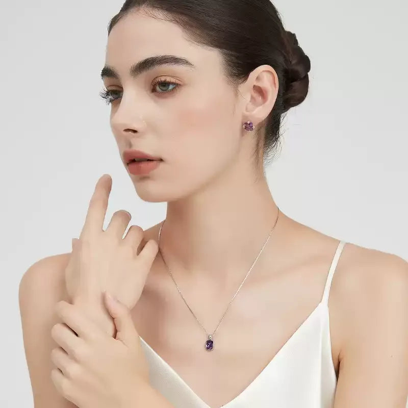 emerald-cut amethyst stud earrings styled portrait showing the earrings for scale