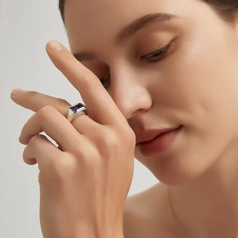 emerald-cut amethyst signet ring styled portrait showing the ring for scale