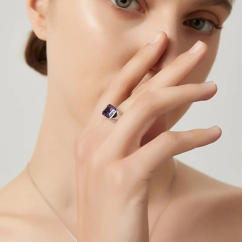 emerald-cut amethyst signet ring worn on the hand from a second angle