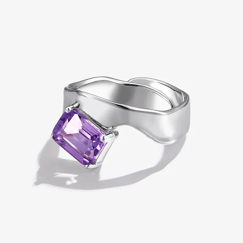 emerald-cut amethyst open ring worn detail beside the face
