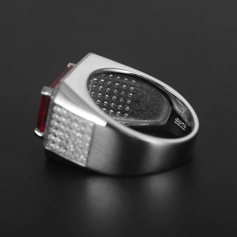 Emerald-Cut Ruby Wide-Band Men's Ring — close-up of ruby setting