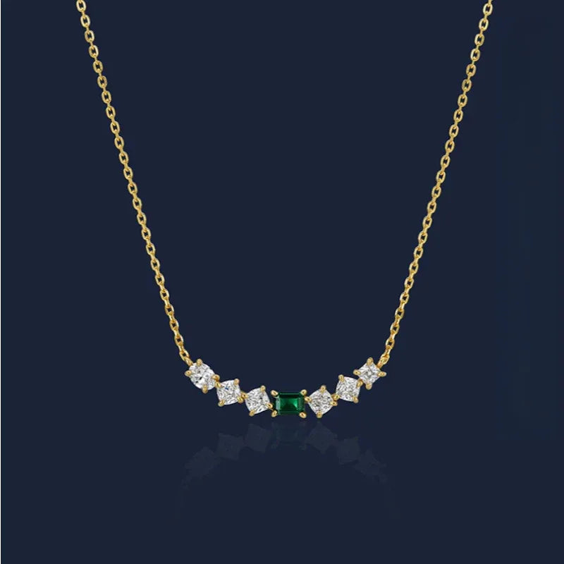 Emerald Leaf Accent Necklace pendant view on a dark background