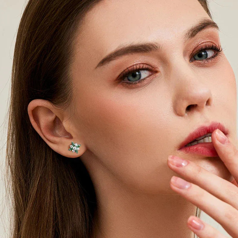 Emerald North Star Stud Earrings worn on the ear from a second angle