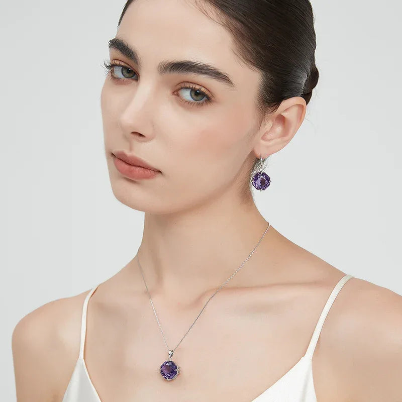fancy-cut amethyst hook earrings styled portrait showing the earrings for scale