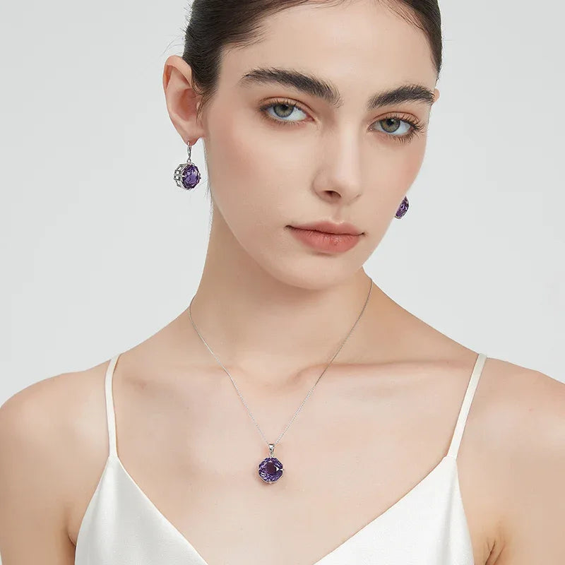 fancy-cut amethyst pendant necklace worn at the neckline in a portrait