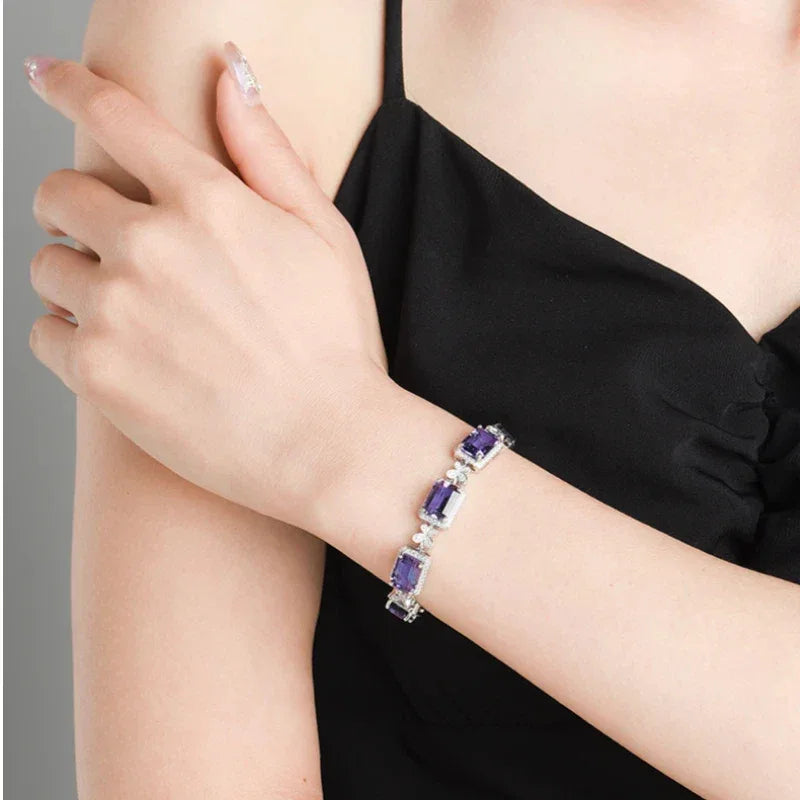 five-stone amethyst bracelet worn on the wrist in a close-up