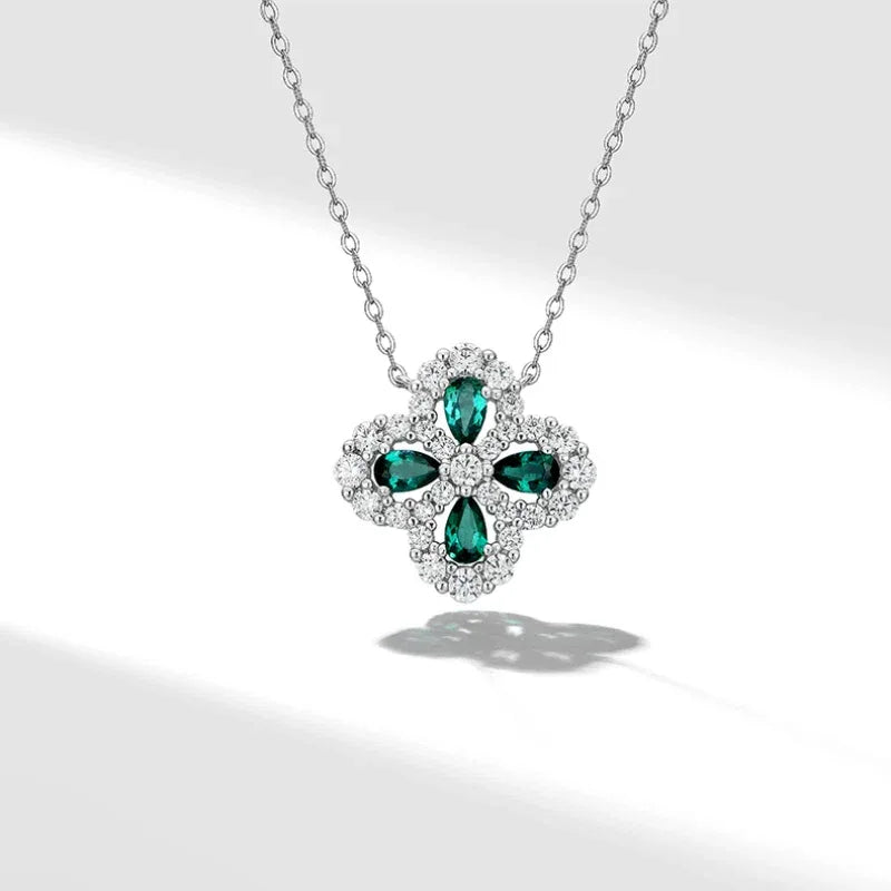 Four-Leaf Emerald Clover Pendant Necklace pendant and chain detail on white