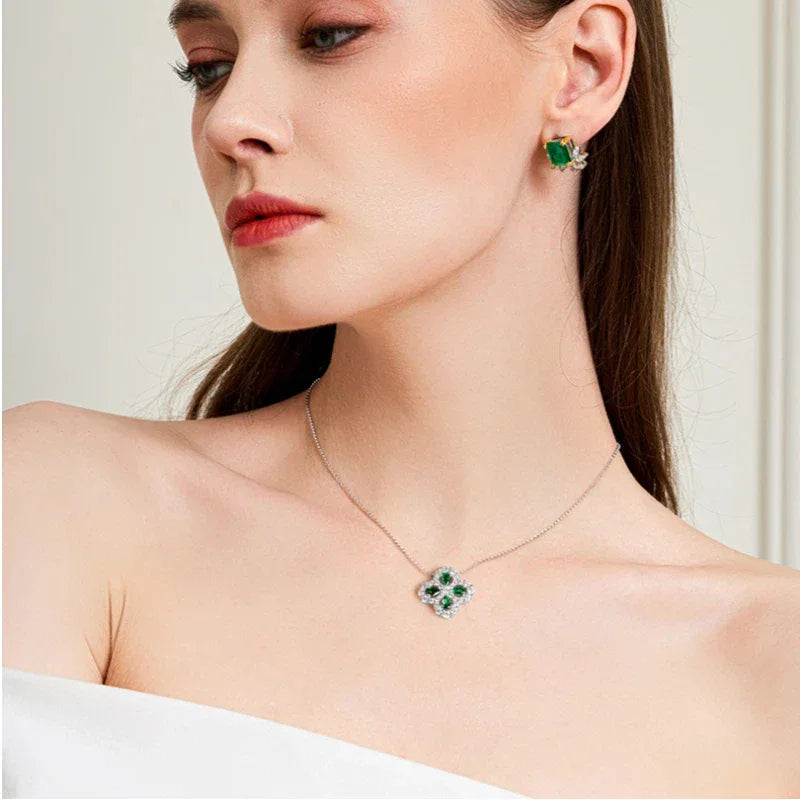 Four-Leaf Emerald Clover Pendant Necklace worn at the neckline from a second angle