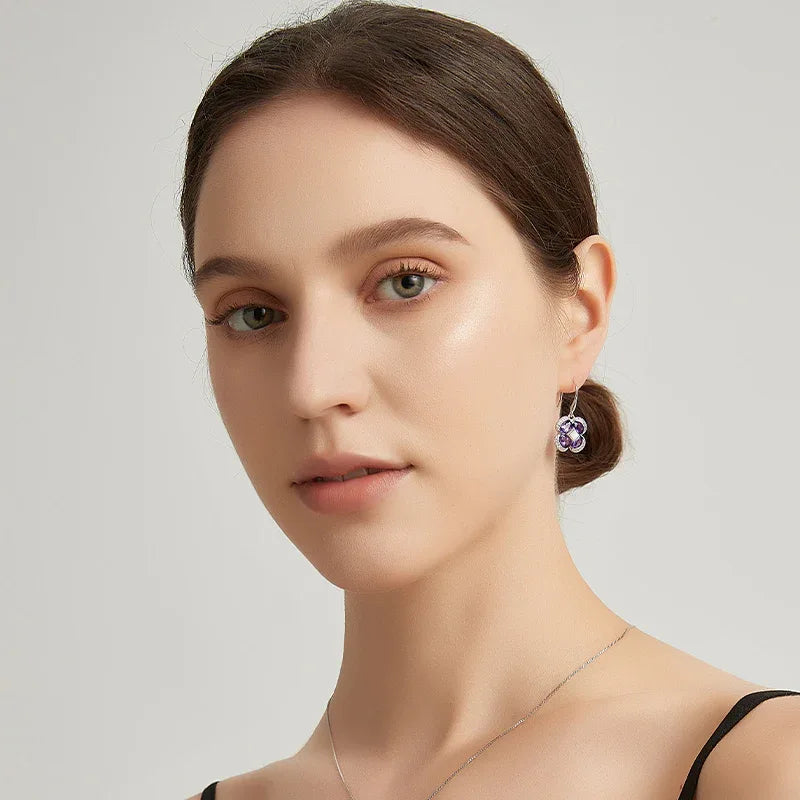 amethyst clover drop earrings styled portrait showing the earrings for scale