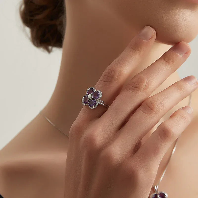 amethyst clover open ring worn on the hand in a close-up