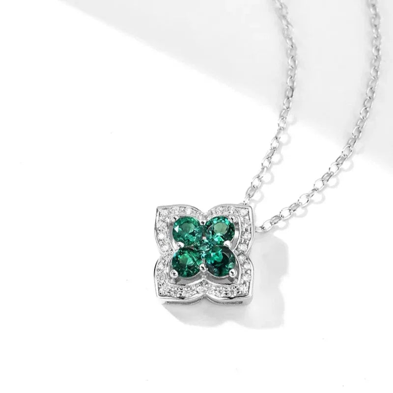 Four-Stone Emerald Floral Pendant Necklace pendant and chain detail on white