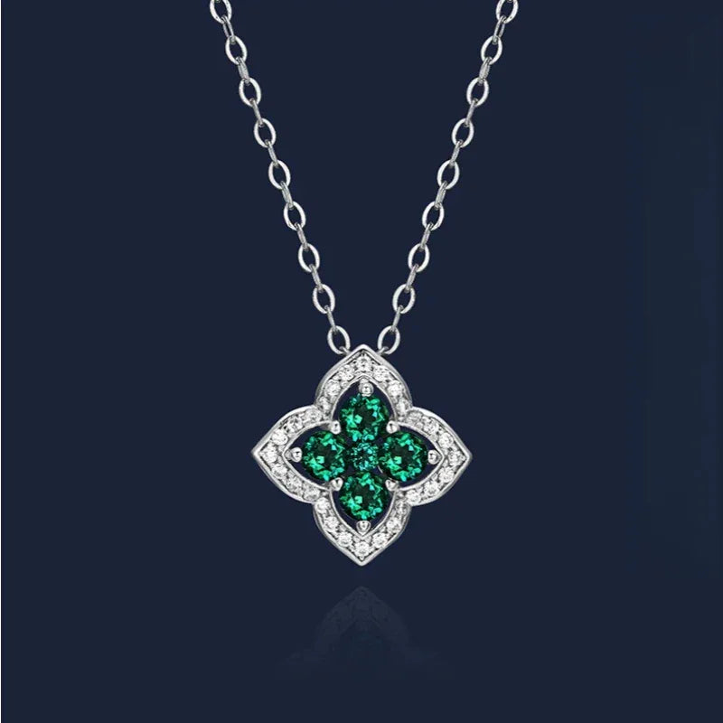 Four-Stone Emerald Floral Pendant Necklace pendant view on a dark background