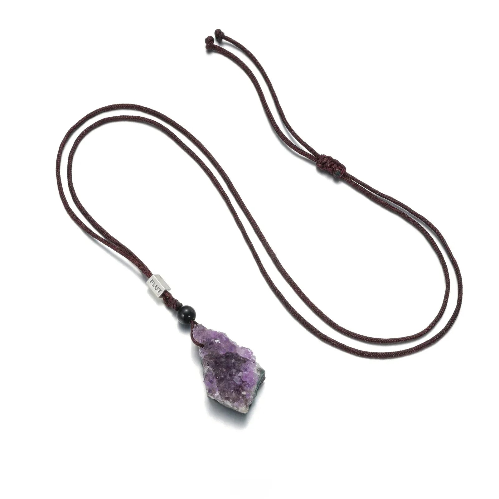 amethyst cluster cord necklace necklace laid flat on a white background