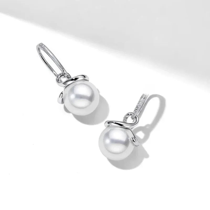 Freshwater Pearl Ribbon Drop Earrings — angled pair on white showing the lever-back fittings
