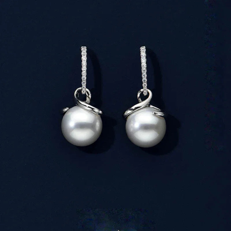 Freshwater Pearl Ribbon Drop Earrings — pair displayed on a dark background