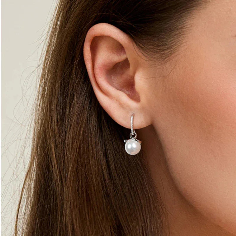 Freshwater Pearl Ribbon Drop Earrings — close right-ear worn view showing scale