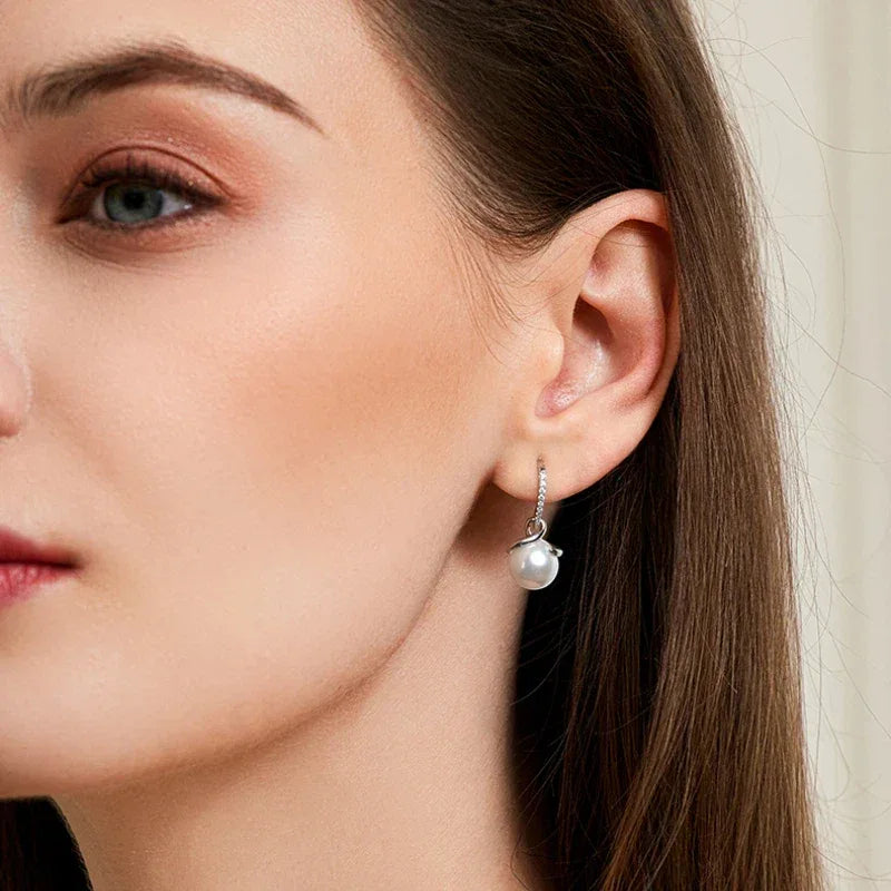 Freshwater Pearl Ribbon Drop Earrings — right-ear worn portrait showing both earrings