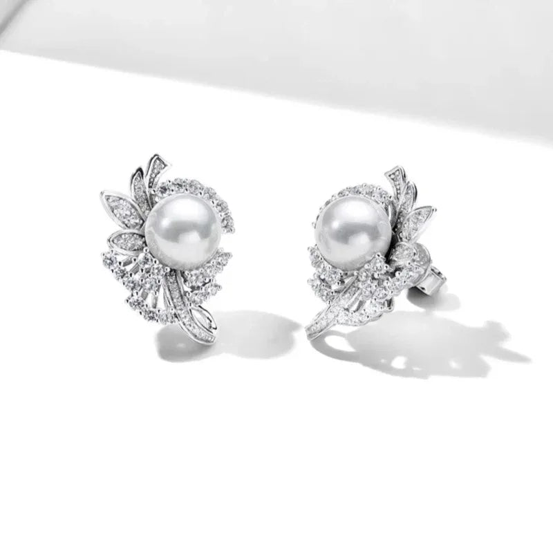 Shell Pearl Floral Cluster Stud Earrings — angled pair on white showing the post backs