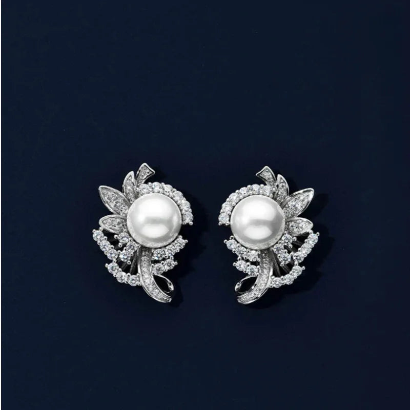 Shell Pearl Floral Cluster Stud Earrings — pair displayed on a dark background