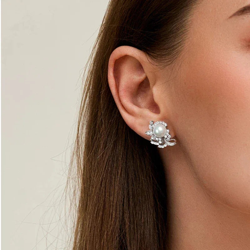 Shell Pearl Floral Cluster Stud Earrings — close right-ear worn view