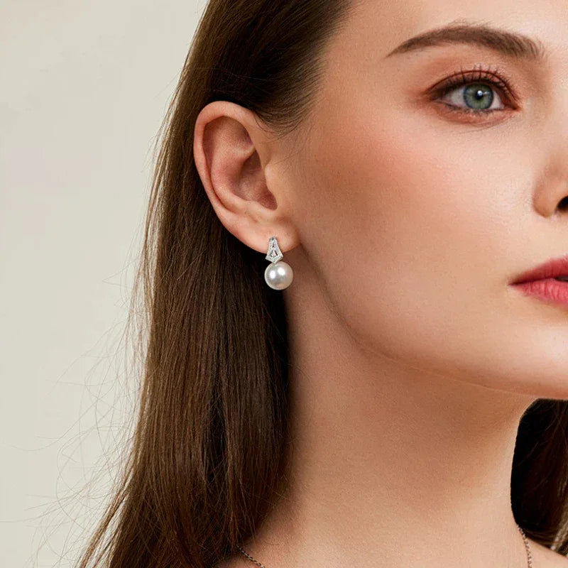 Pearl Drop Earrings with Geometric Fan Detail — alternate left-ear worn portrait
