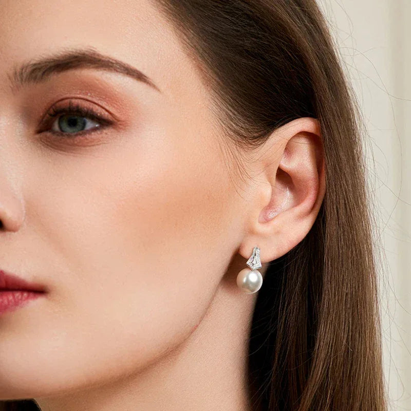 Pearl Drop Earrings with Geometric Fan Detail — right-ear worn portrait showing both earrings