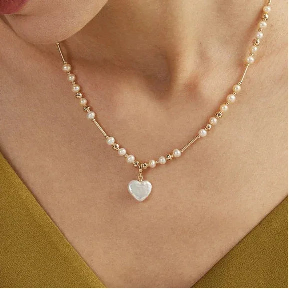 Baroque Pearl Heart Pendant Necklace with Gold Bar Accents — alternate neckline-worn close-up
