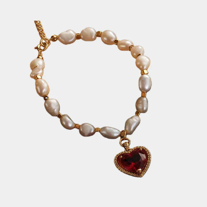Pearl Bracelet with Red Heart Charm — front view of irregular pearl bracelet with a red heart charm