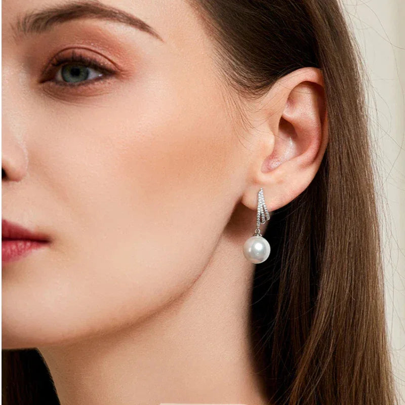 Pearl Tassel Drop Earrings — right-ear worn portrait showing the earring profile