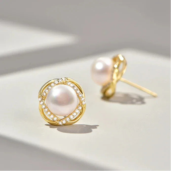 Pearl Halo Stud Earrings — angled pair showing the side profile and post backs