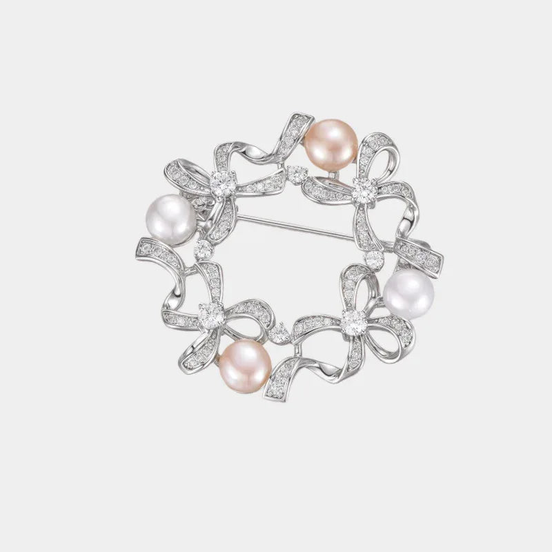 Pearl Bow Wreath Brooch — front view of circular bow wreath brooch