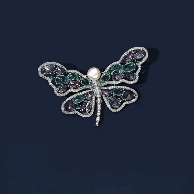 Pearl Purple and Aqua Butterfly Brooch — front product view on a dark background