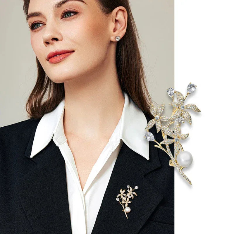 Freshwater Pearl Daffodil Branch Brooch — model portrait with the brooch pinned on a dark blazer