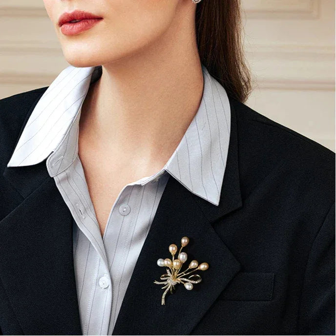 Two-Tone Pearl Spray Bouquet Brooch — model portrait with the brooch at the lapel