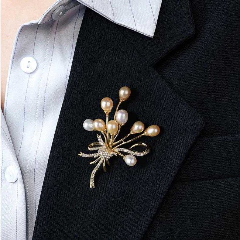 Two-Tone Pearl Spray Bouquet Brooch — close blazer-worn view showing the brooch vertically