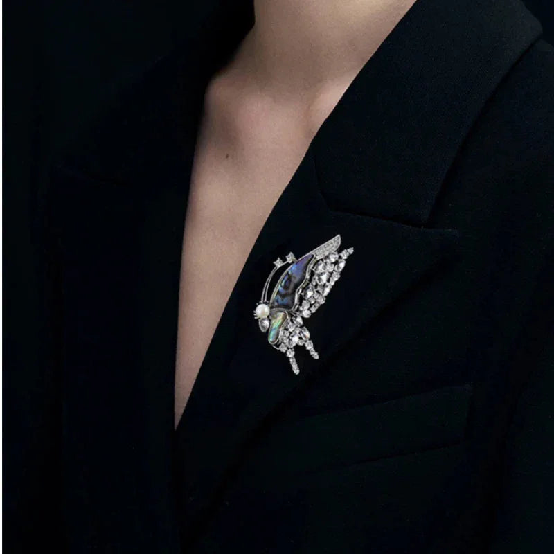 Blue-Green Mother-of-Pearl Butterfly Brooch with Pearl — alternate black-blazer worn view