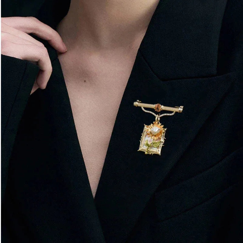 Pearl Sunflower Frame Brooch — close black-blazer worn view showing scale