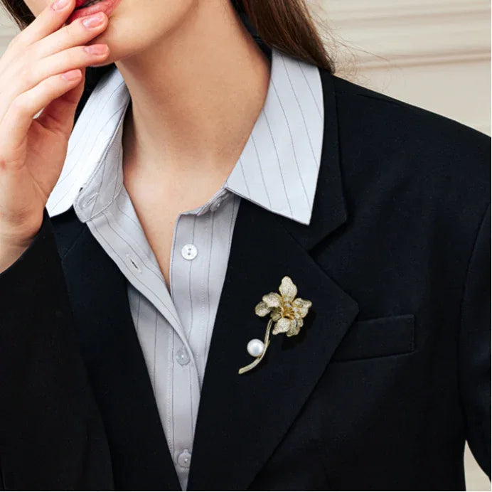 Freshwater Pearl Iris Flower Brooch — model portrait with the brooch pinned on a dark blazer