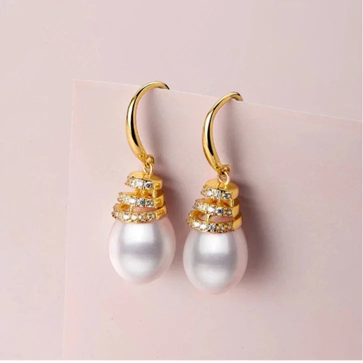 Pearl Beehive Drop Earrings in Gold-Plated S925 Silver — front pair on a pale pink surface