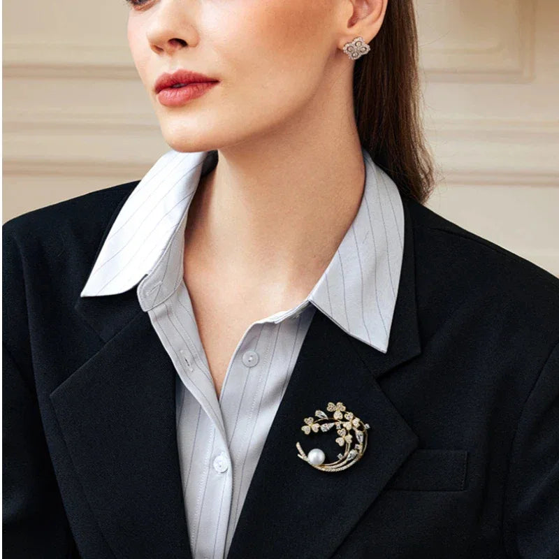 Freshwater Pearl Crescent Floral Brooch — close blazer-worn view showing the crescent orientation