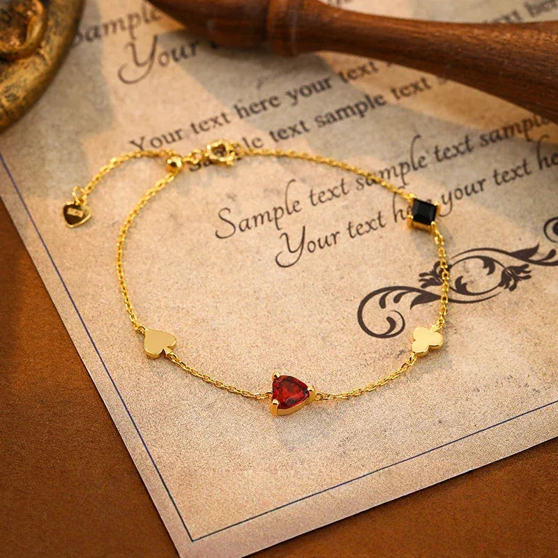 Garnet and Black Onyx Adjustable Bracelet full bracelet view on a dark background