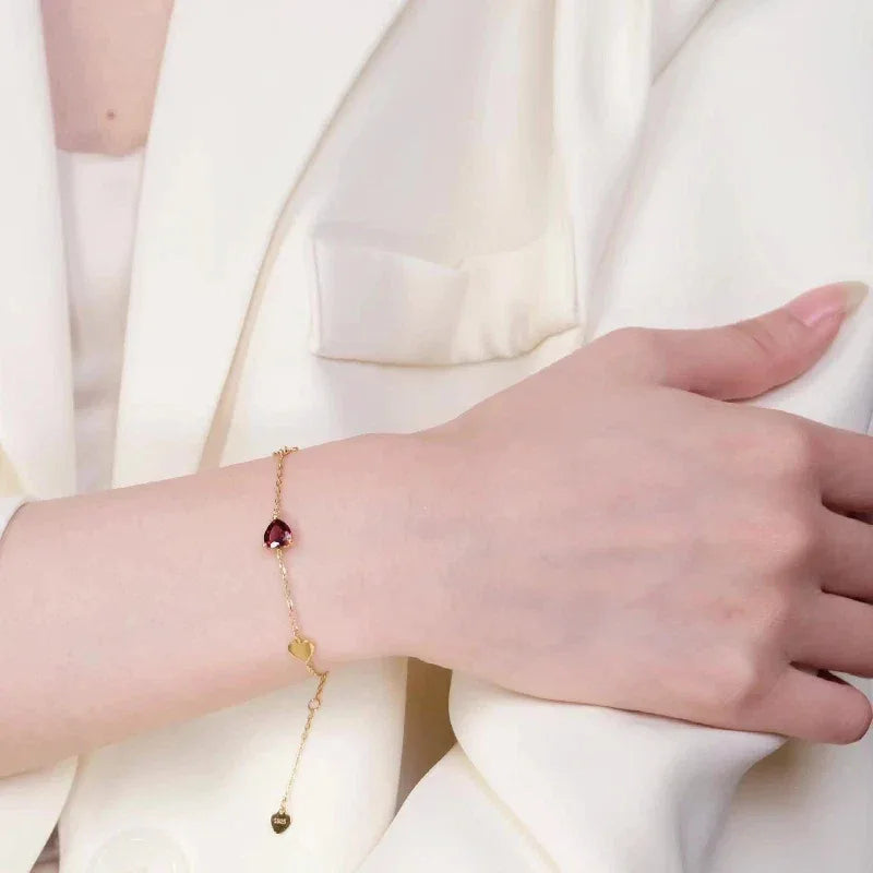 Garnet and Black Onyx Adjustable Bracelet worn on the wrist in a close-up